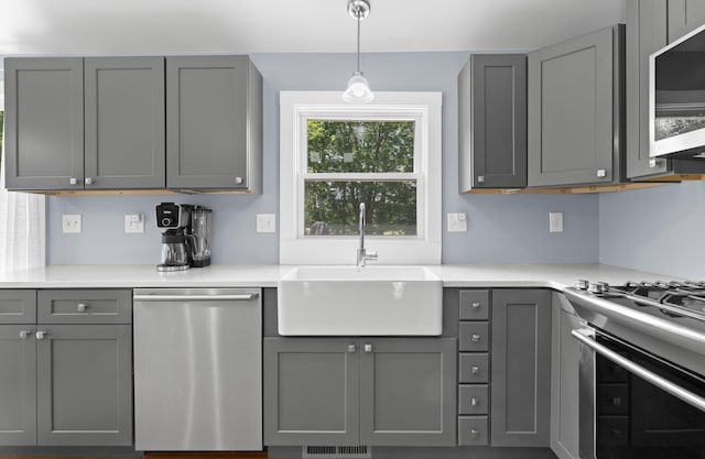 4 Crestview Ter, Stratham, NH 03885 - kitchen with appliances with stainless steel finishes, gray cabinets, a sink, and light countertops