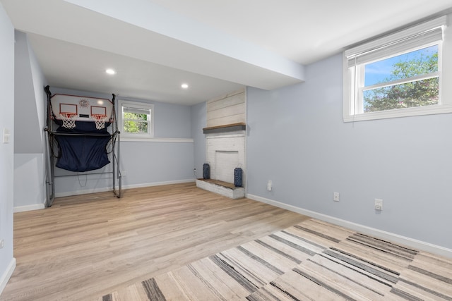 4 Crestview Ter, Stratham, NH 03885 - basement with a fireplace, light wood finished floors, baseboards, and recessed lighting