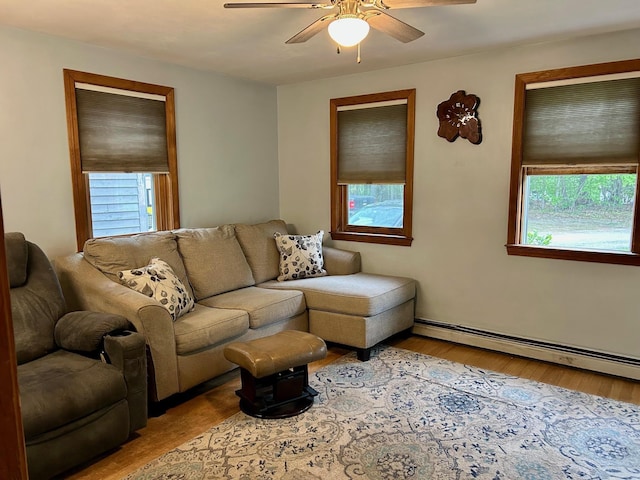 348 Ridge Rd, Northwood, NH 03261 - living room featuring wood finished floors, ceiling fan, baseboard heating, and baseboards