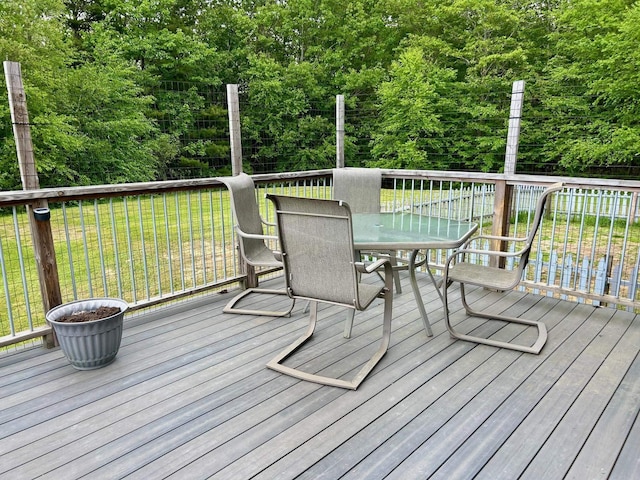 348 Ridge Rd, Northwood, NH 03261 - wooden terrace featuring outdoor dining space, a yard, and a wooded view