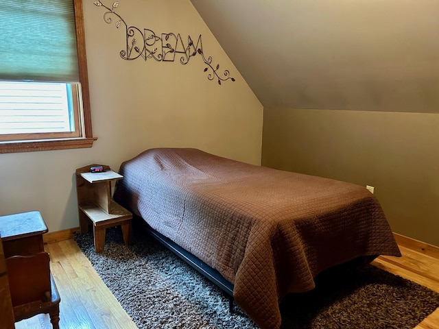 348 Ridge Rd, Northwood, NH 03261 - bedroom featuring wood finished floors, vaulted ceiling, and baseboards