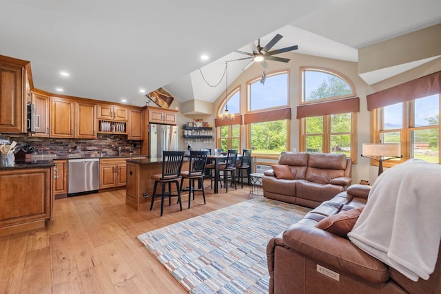 23 Jack O Lantern Dr Unit 18, Woodstock, NH 03262 - living area with healthy amount of natural light, a ceiling fan, light wood-type flooring, recessed lighting, and high vaulted ceiling