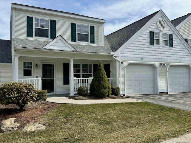 4 Bow Center Rd Unit B-3, Bow, NH 03304 - view of front facade with covered porch, driveway, an attached garage, a front lawn, and roof with shingles