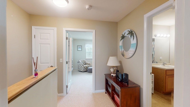4 Bow Center Rd Unit B-3, Bow, NH 03304 - hallway featuring light carpet, a sink, and baseboards