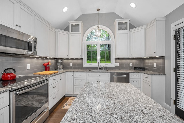 7 Lilac Ct Unit 335, Nashua, NH 03062 - kitchen with appliances with stainless steel finishes, a sink, white cabinets, lofted ceiling, and recessed lighting