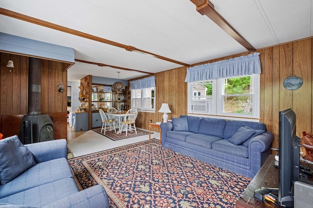 21 Pine Hill Dr, Barnstead, NH 03225 - living room featuring a wood stove, wood walls, and beamed ceiling