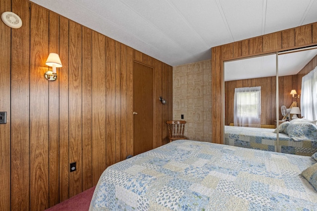 21 Pine Hill Dr, Barnstead, NH 03225 - carpeted bedroom featuring a closet and wood walls