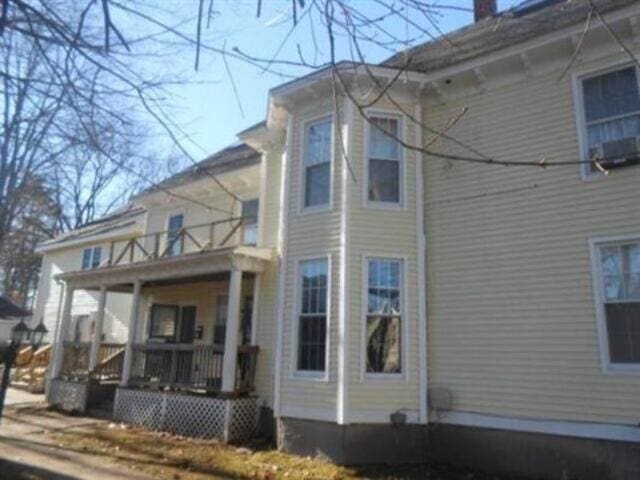 35-37 Courtland St, Nashua, NH 03060 - rear view of house featuring a balcony
