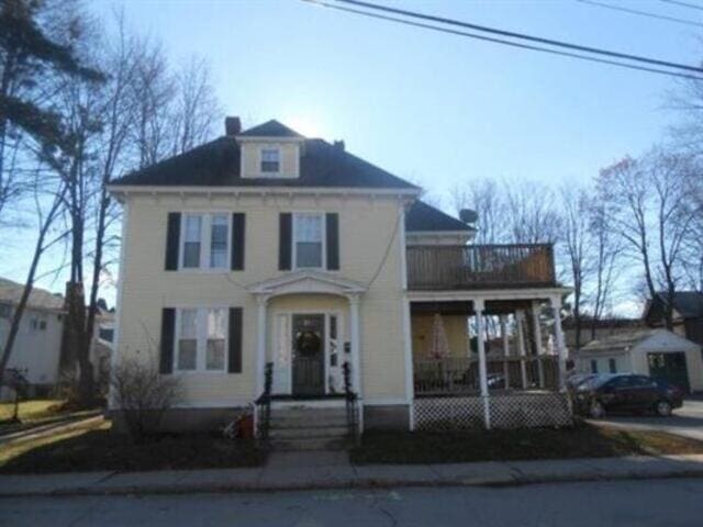 35-37 Courtland St, Nashua, NH 03060 - traditional style home featuring a balcony, a chimney, and covered porch