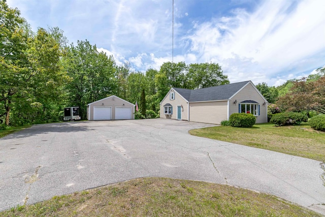 212 W Main St, Hillsborough, NH 03244 - view of front of property featuring a detached garage, an outbuilding, and a front yard