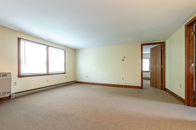 212 W Main St, Hillsborough, NH 03244 - spare room featuring a baseboard heating unit, light carpet, baseboard heating, and baseboards