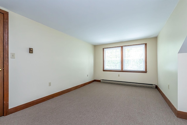 212 W Main St, Hillsborough, NH 03244 - spare room with a baseboard heating unit, light carpet, and baseboards