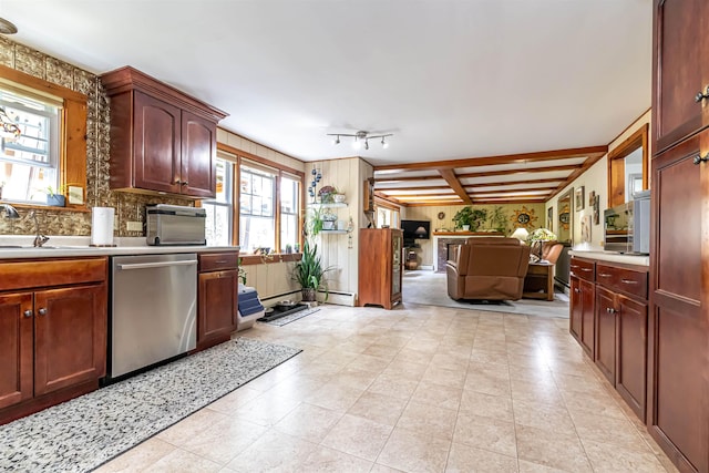 212 W Main St, Hillsborough, NH 03244 - kitchen with stainless steel dishwasher, light countertops, open floor plan, backsplash, and light tile patterned floors