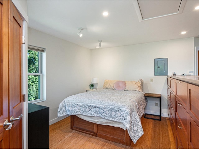 71 N Ave Unit 203, Burlington, VT 05401 - bedroom with baseboards, electric panel, light wood-style flooring, and recessed lighting