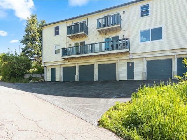 71 N Ave Unit 203, Burlington, VT 05401 - view of building exterior featuring a garage and driveway