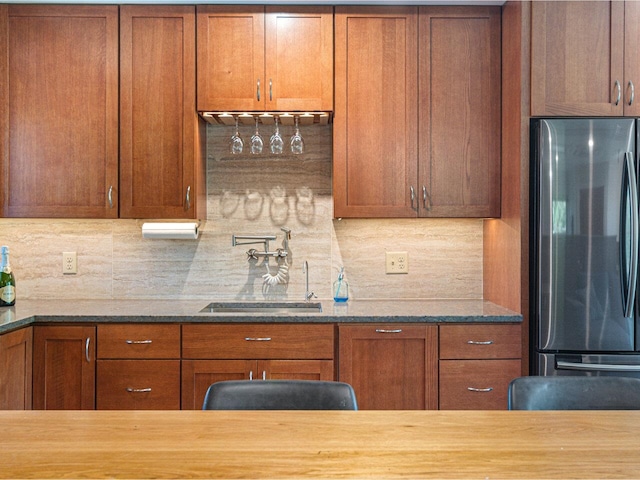 71 N Ave Unit 203, Burlington, VT 05401 - kitchen featuring freestanding refrigerator, a sink, tasteful backsplash, and brown cabinets