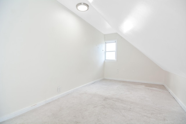 521 Wilson St, Manchester, NH 03103 - bonus room featuring lofted ceiling, light carpet, and baseboards