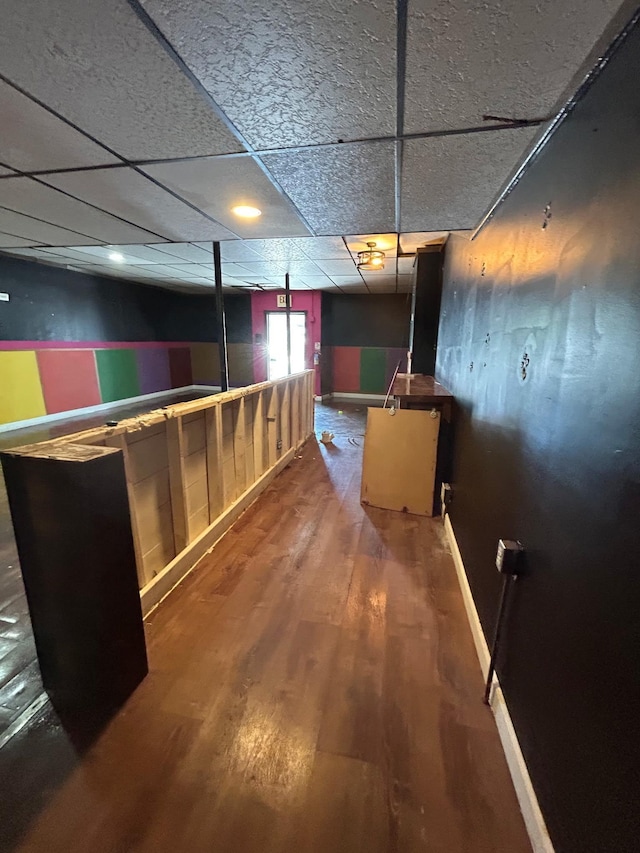 521 Wilson St, Manchester, NH 03103 - bar featuring wood finished floors, a paneled ceiling, and baseboards