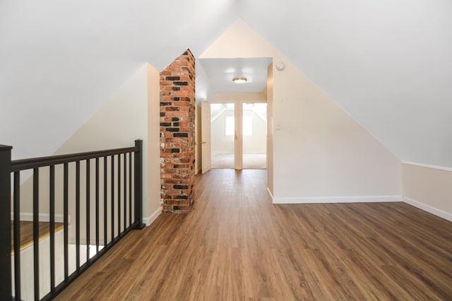 521 Wilson St, Manchester, NH 03103 - bonus room featuring lofted ceiling, wood finished floors, and baseboards