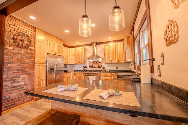 57 Main St, Woodstock, NH 03262 - kitchen with stainless steel appliances, wall chimney exhaust hood, light brown cabinets, a sink, and recessed lighting