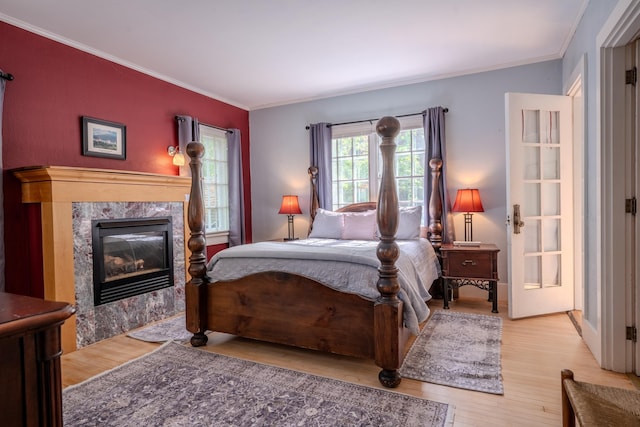 57 Main St, Woodstock, NH 03262 - bedroom featuring wood finished floors, ornamental molding, and a fireplace