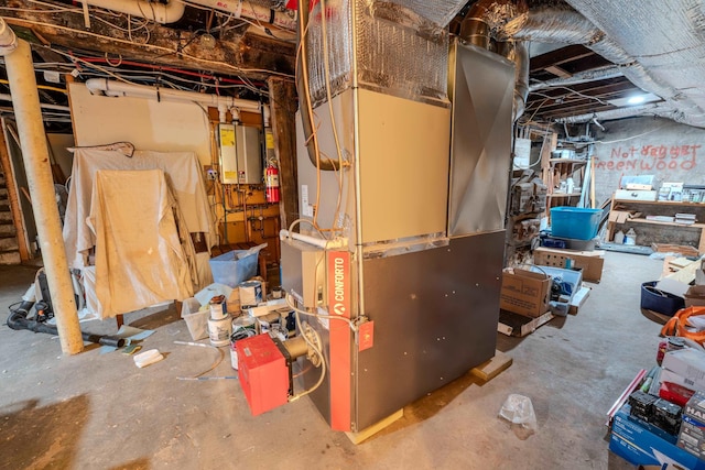 57 Main St, Woodstock, NH 03262 - unfinished basement featuring heating unit and tankless water heater