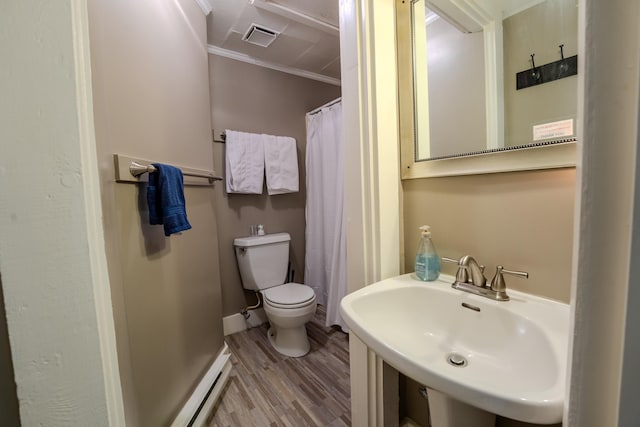 57 Main St, Woodstock, NH 03262 - bathroom with a sink, wood finished floors, toilet, ornamental molding, and baseboard heating
