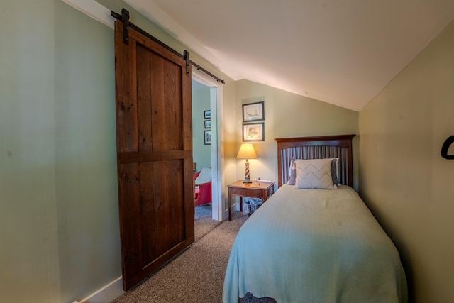 57 Main St, Woodstock, NH 03262 - bedroom featuring a barn door, carpet floors, and vaulted ceiling