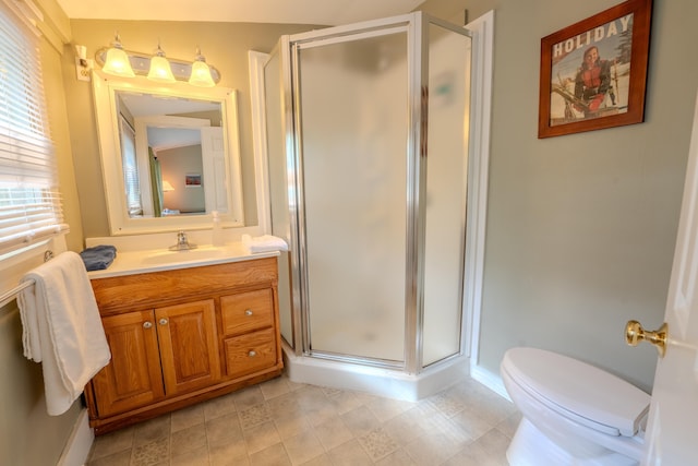 57 Main St, Woodstock, NH 03262 - full bathroom with vanity, a stall shower, toilet, tile patterned flooring, and baseboards