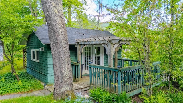 57 Main St, Woodstock, NH 03262 - view of front facade with a shingled roof, french doors, and a deck