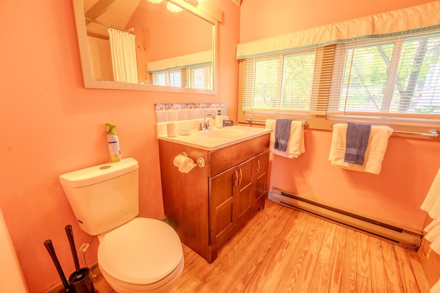 57 Main St, Woodstock, NH 03262 - bathroom featuring baseboard heating, healthy amount of natural light, vanity, and wood finished floors