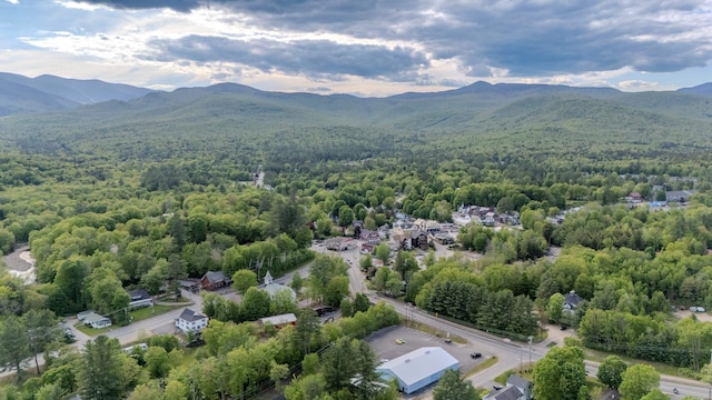 57 Main St, Woodstock, NH 03262 - drone / aerial view of a heavily wooded area and mountains