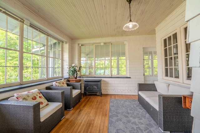 57 Main St, Woodstock, NH 03262 - sunroom featuring wood ceiling, hardwood / wood-style floors, and a wood stove