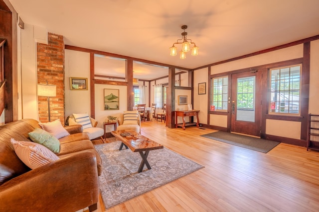 57 Main St, Woodstock, NH 03262 - living area featuring wood finished floors, baseboards, and a chandelier