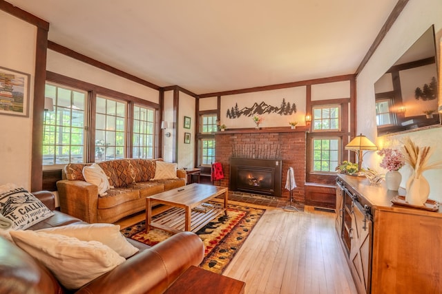 57 Main St, Woodstock, NH 03262 - living area featuring hardwood / wood-style floors, plenty of natural light, ornamental molding, and a fireplace