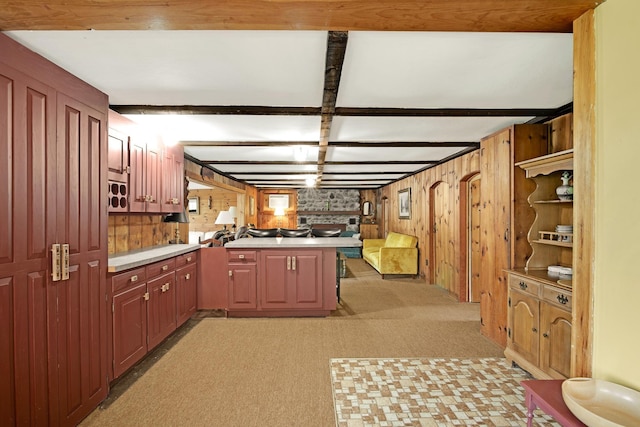 78 Windy Point Rd S, Wakefield, NH 03872 - kitchen featuring a peninsula, light carpet, light countertops, and wood walls