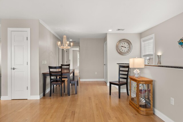 562 Nashua St, Seabrook, NH 03874 - dining space with a chandelier, light wood finished floors, baseboards, and recessed lighting