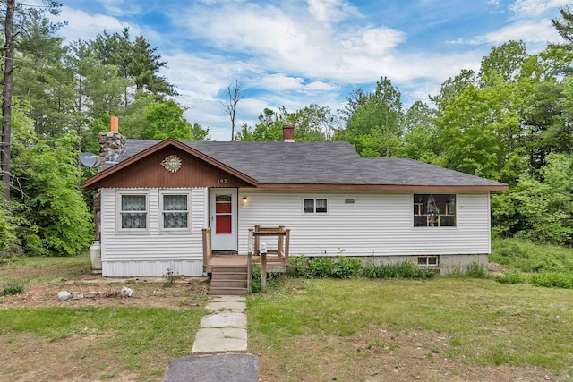 132 Willey Rd, Milton, NH 03852 - view of front of home with a chimney, a front yard, and roof with shingles
