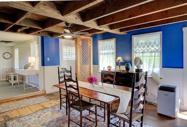 398 N Rd, Milton, VT 05468 - dining area with hardwood / wood-style flooring, ceiling fan, healthy amount of natural light, and a wainscoted wall