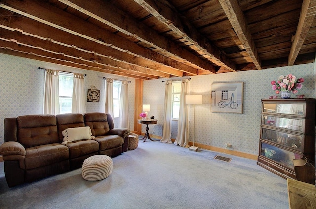 398 N Rd, Milton, VT 05468 - living area with wallpapered walls, carpet flooring, wooden ceiling with exposed beams, and baseboards