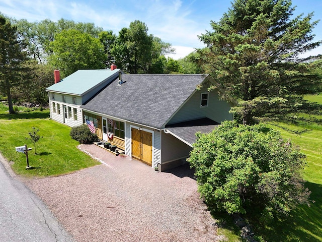 398 N Rd, Milton, VT 05468 - view of front of home with roof with shingles, a chimney, a front yard, and gravel driveway