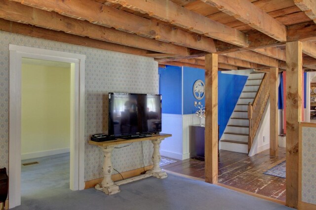398 N Rd, Milton, VT 05468 - below grade area with wallpapered walls, stairs, and baseboards