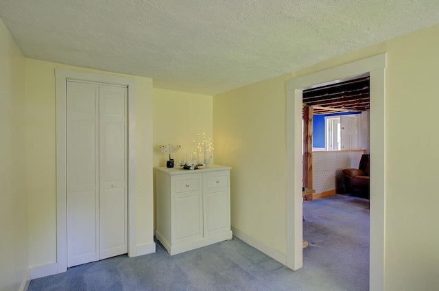 398 N Rd, Milton, VT 05468 - bedroom featuring light carpet, a textured ceiling, a closet, and baseboards