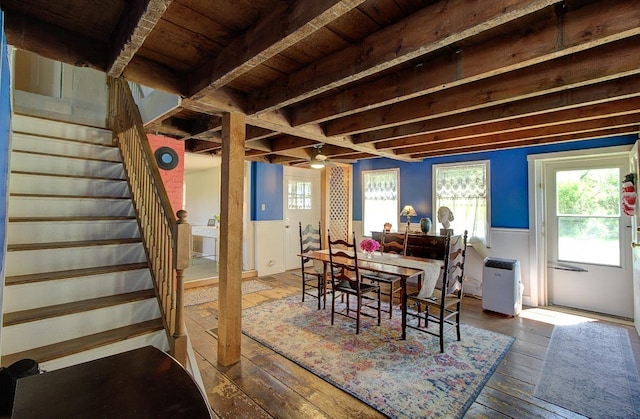 398 N Rd, Milton, VT 05468 - dining room featuring stairway, wood-type flooring, a wainscoted wall, and plenty of natural light