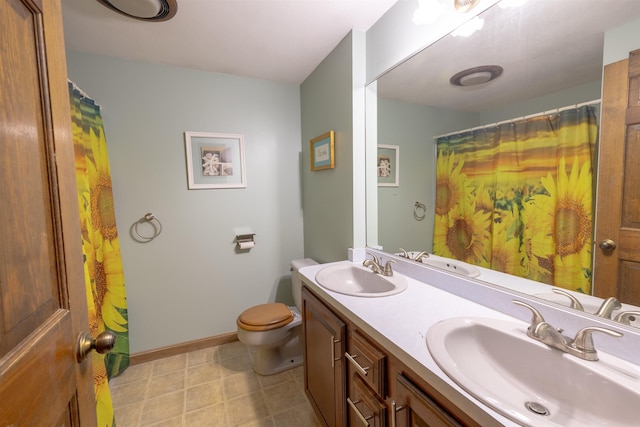 16 Berkeley St, Pelham, NH 03076 - bathroom featuring double vanity, toilet, baseboards, and curtained shower