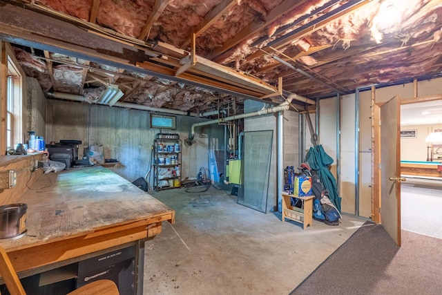 16 Berkeley St, Pelham, NH 03076 - unfinished below grade area with a wood stove