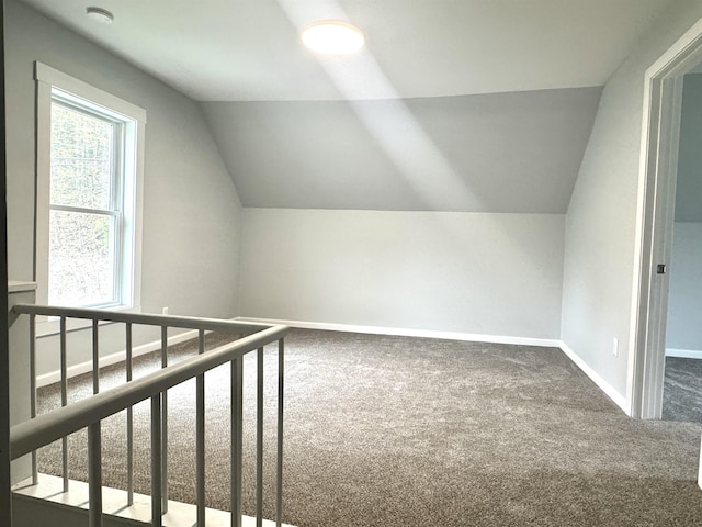 217 Clyde St, Newport City, VT 05855 - additional living space with carpet flooring, vaulted ceiling, and baseboards