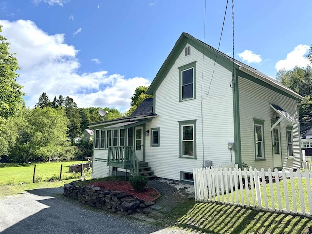 217 Clyde St, Newport City, VT 05855 - rear view of house featuring a sunroom
