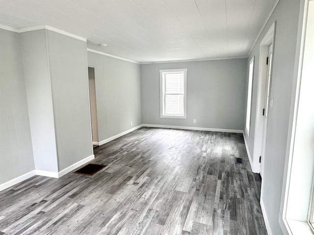 217 Clyde St, Newport City, VT 05855 - unfurnished room featuring dark wood-style flooring, ornamental molding, and baseboards