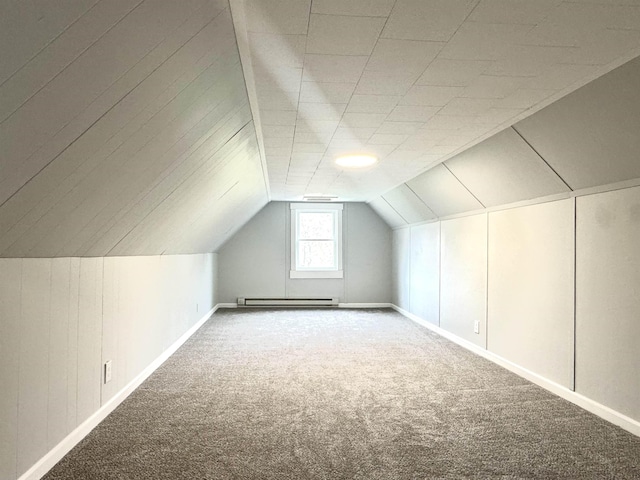217 Clyde St, Newport City, VT 05855 - additional living space with carpet flooring, baseboard heating, baseboards, and vaulted ceiling
